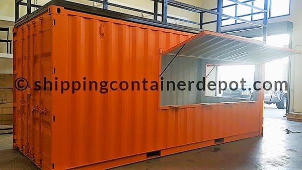 An orange shipping container with a company logo.