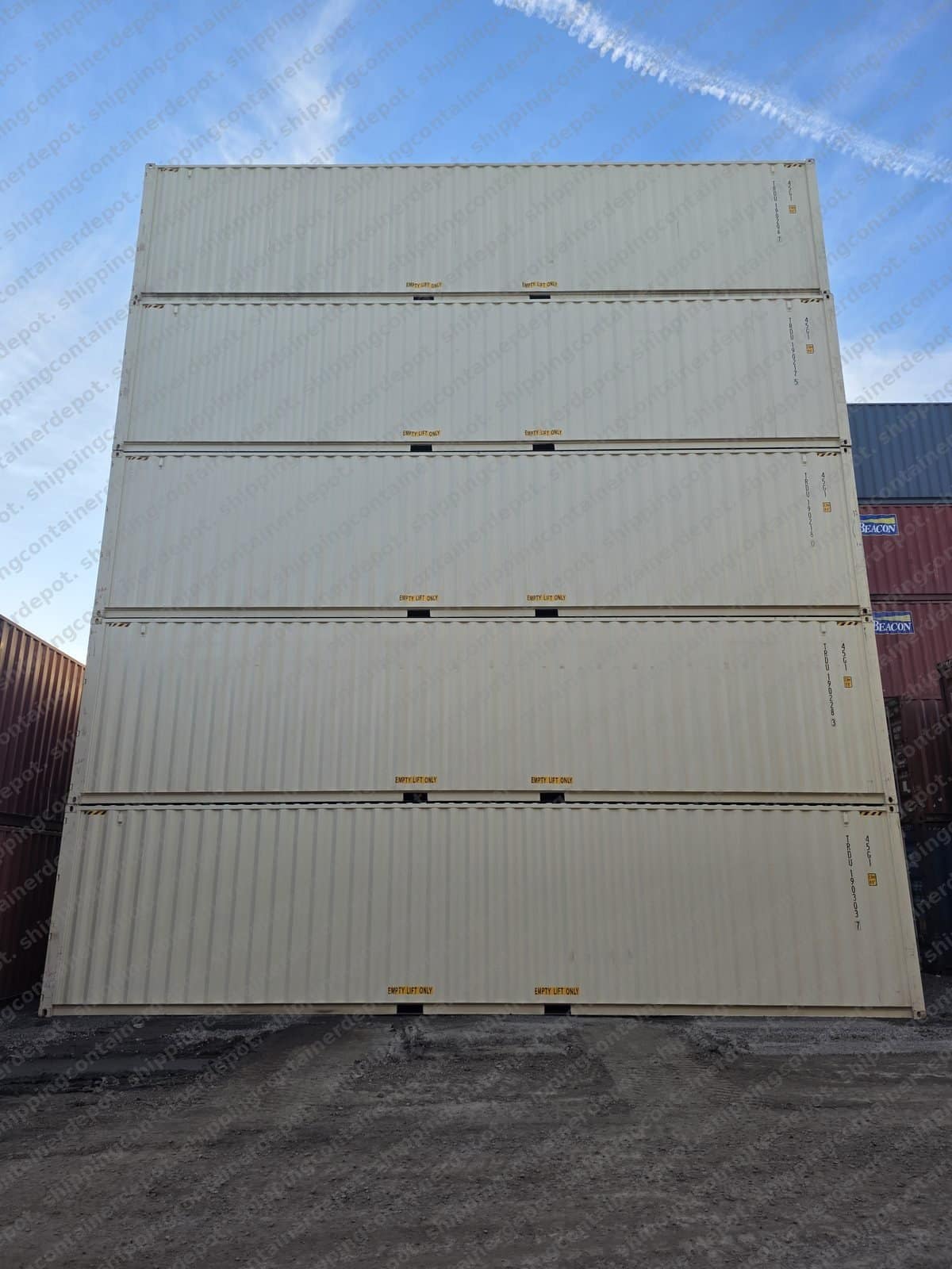 New one-trip shipping containers stacked at our California depot